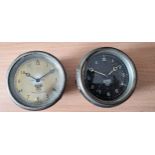 A Smiths black dial dash board clock, 3 1/2", not working, and a Smiths P-H-5054 dash board clock, 3