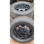 A set of four Toyota Hi Ace wheels and tyres, recently powder coated, as new tyres