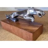 A Jaguar Mk2 leaping cat mascot, 18cm, mounted on a hardwood base.