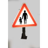 A triangular illuminated road sign depicting pedestrians in the road, 100 x 69 cm