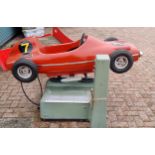 A RGM Red Flash coin operated Ferrari red race car amusement machine, c.1960/70's. Sold as seen,