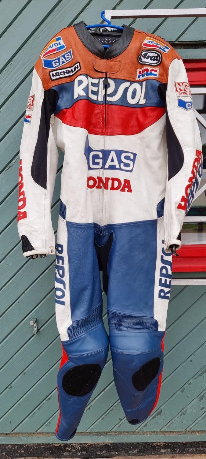 An Echt Ledr Honda Repsol one piece leather race suit, size XXL, with protectors