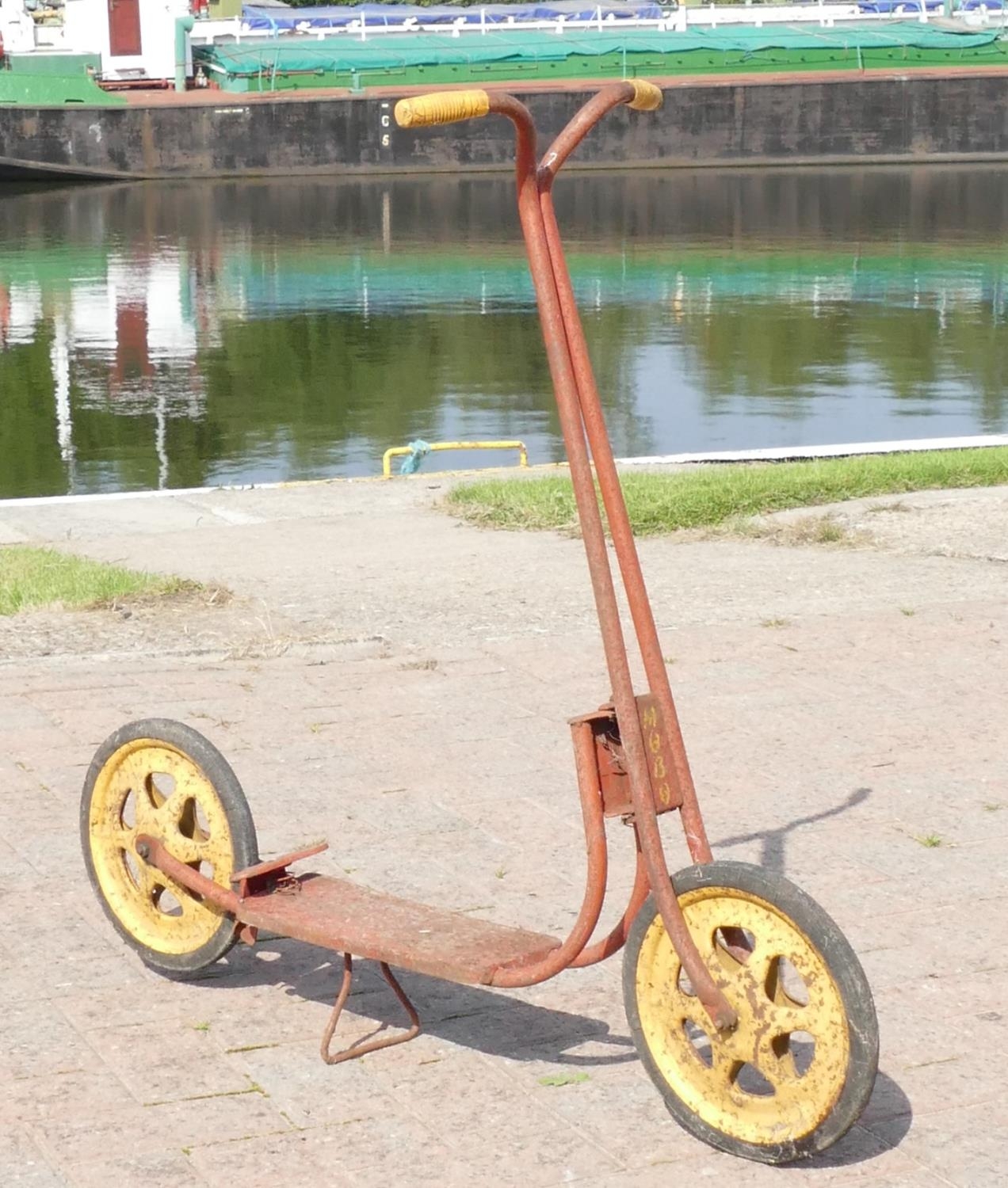 A MOBO child's red and yellow scooter