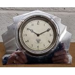 A Smiths 3 1/2" dash mounted motor car manual wind clock, dial numbered P-557.950