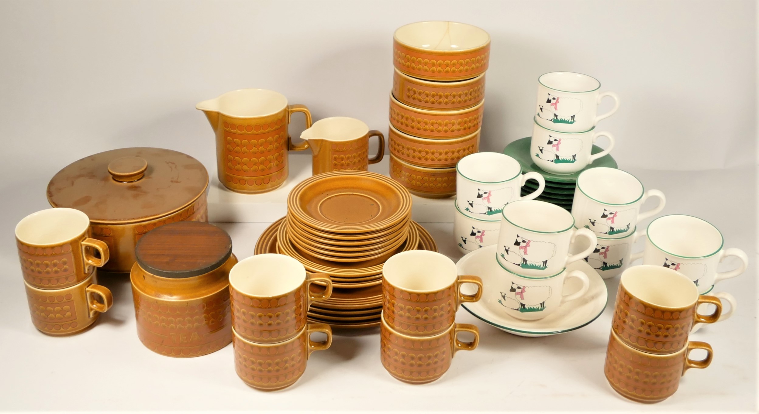 A collection of Hornsea 'Saffron' dinnerware 'C1970s, together with Hornsea 'Farmyard' cups &