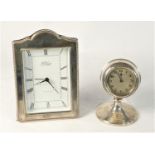 A hallmarked silver photo frame quartz desk clock by R. Carr Clock Maker England. 17cm tall,