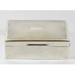 A silver cigarette box, Birmingham 1945, with engine turned decoration, vacant cartouche, cedar