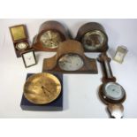 A collection of oak cased manual wind mantle clocks, together with wall barometers, carriage