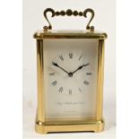 A brass cased manual wind carriage clock, jewelled striking to bell, movement stamped made in West