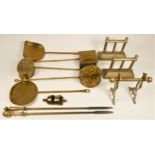 A collection of brassware to include, late 19th Century chestnut roasters, skimmers, fire irons &