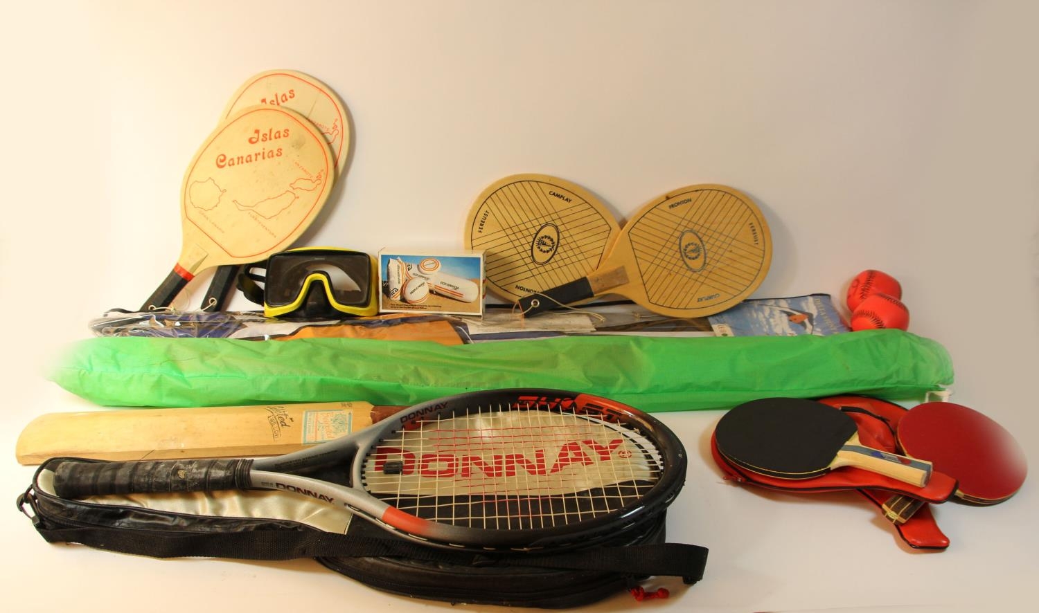 Two stunt kites together with sporting equipment to include, cricket bat & balls, tennis rackets and