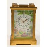 A Deacon manual wind carriage clock, gilt brass case with hand painted enamelled face, dial and side