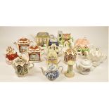 A large collection of ceramic novelty and other teapots in four boxes. (4)