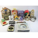 A collection of novelty clocks, to include a 1980s Kellogg's bedside alarm clock, a Disney 'Notre