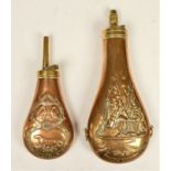 A reproduction Colt's Patent embossed copper powder flask, decorated with cannons and flags and