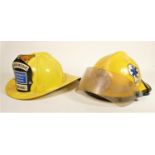 Two American paramedic fire helmets, emergency medical service of Chicago, with brass crest,