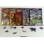 A collection of Games Workshop books, including How To Paint Citadel Miniatures (2008), How To