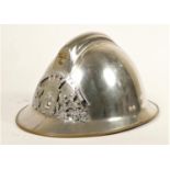 A French fire helmet, chromed brass with Sapeurs Pompiers De L'essonne crest, fitted leather cap