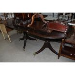 A reproduction Regency extending dining table