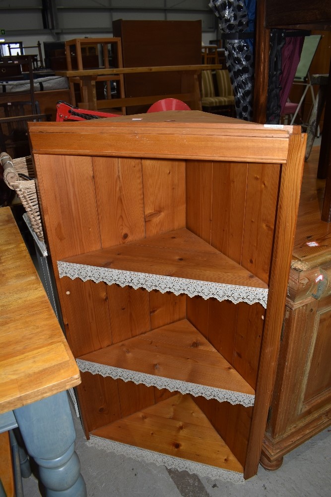 A natural pine corner shelf