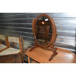 An early 20th Century mahogany toilet mirror (missing top finial)