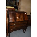 An early to mid 20th Century flame mahogany bureau on cabriole legs with ball and claw feet, width