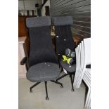 A pair of modern office or gaming chairs, futuristic style