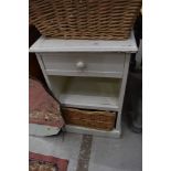 A painted bathroom shelf with underbasket
