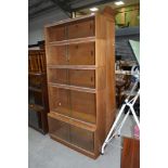 A vintage Simplex stacking bookcase in light mahogany, 5 tiers, overall dimensions approx. H182cm