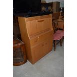 A vintage laminate teak effect bureau, width approx. 79cm