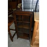 An early 20th Century oak narrow bookcase, width approx. 46cm, height 100cm