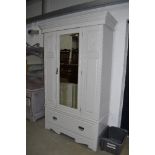 A later painted Victorian mirror door wardrobe, on drawer base, width approx. 133cm