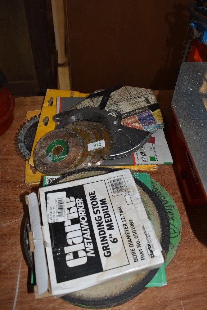 A selection of stone metal and similar cutting disks including Clarke grinding stone