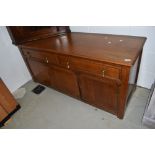 An early 20th Century oak sideboard or dresser base, width approx. 135 height 63cm