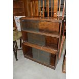 An early 20th Century oak stacking bookcase of three tiers, width approx. 89cm