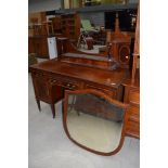 An early 20th Century mahogany and inlaid dressing table, labelled and stamped Maple and Co, width