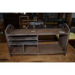 An Arts and Crafts style oak stationery rack, width approx. 46cm