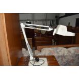 A vintage Luxa magnifying angle poise lamp