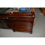 A reproduction Regency style low shelf unit with two frieze drawers, width approx. 76cm