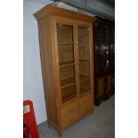A nice quality golden oak display cabinet , retailed by Marks and Spencer, approx. dimensions W108cm