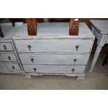 A 'shabby chic' chest of three drawers. Width approx. 90cm