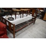 An early 20th Century mahogany bed frame (138cm - 4ft6) , by Staples and Co, with sprung base ,