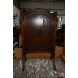 A mid 20th Century oak firescreen