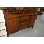 An early to mid 20th Century walnut breakfront sideboard on Queen Anne style cabriole legs, width