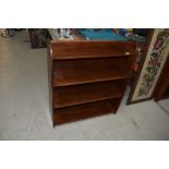 A mid 20th Century stained frame low bookshelf, width approx. 76cm