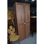 A rustic pine shallow cupboard, dimensions approx. W77 H184 D25cm