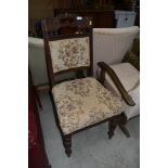 A Victorian mahogany dining chair having overstuffed seat and back and later upholstery