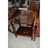 A traditional cane back tub chair