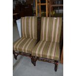 A pair of Period turned frame dining chairs having later upholstery