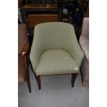 A traditional tub chair in modern upholstery